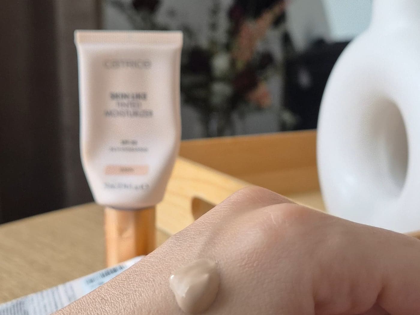 One full pump of Catrice Skin Like Tinted Moisturizer SPF 30 on the back of a hand
