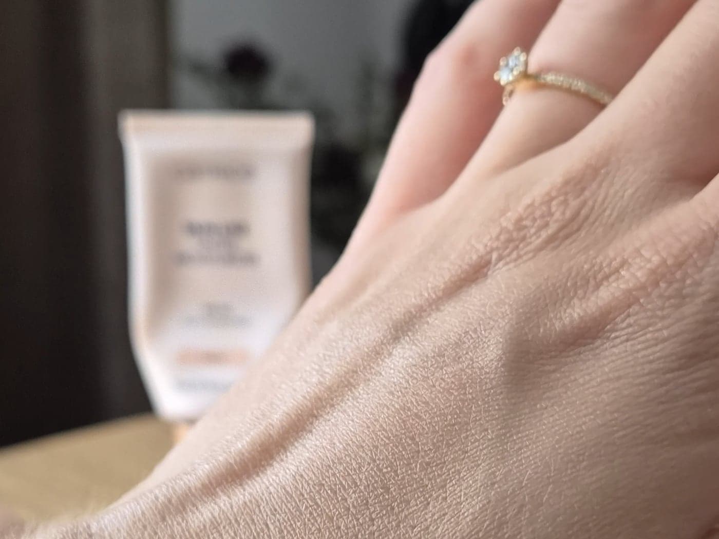 Catrice Skin Like Tinted Moisturizer shade 030N blended into the back of a hand