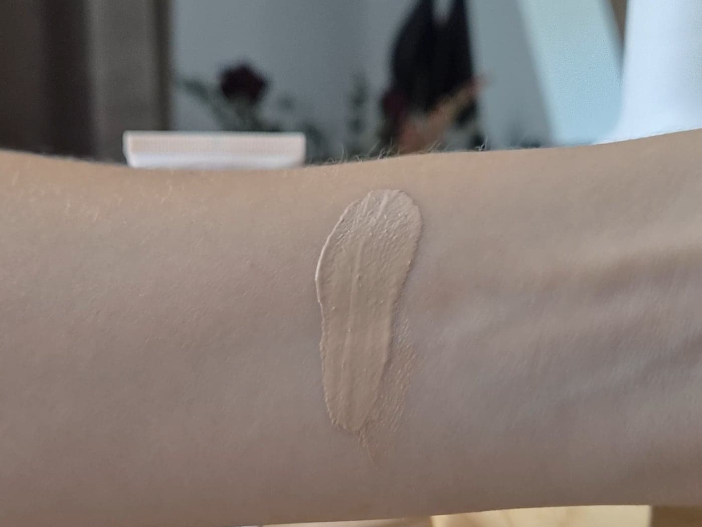 Unblended swatch of Catrice Skin Like Tinted Moisturizer shade 030N on the forearm